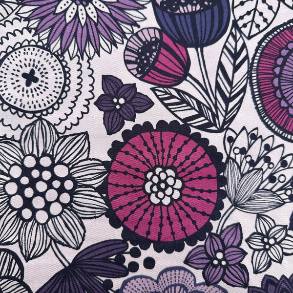 Close up of Nordic Flower cotton oxford fabric in purple by Cosmo Textiles Imported from Japan