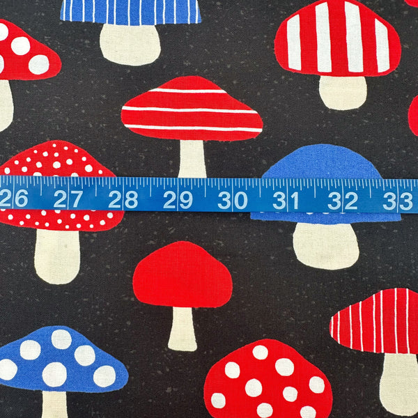 Scale of Nordic Mushroom cotton fabric in black by Cosmo Textiles featuring Scandinavian-inspired mushroom illustrations imported from Japan
