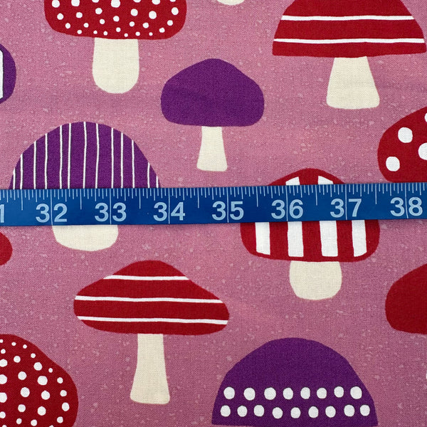 Scale of Nordic Mushroom cotton fabric in mauve by Cosmo Textiles featuring Scandinavian-inspired mushroom illustrations imported from Japan