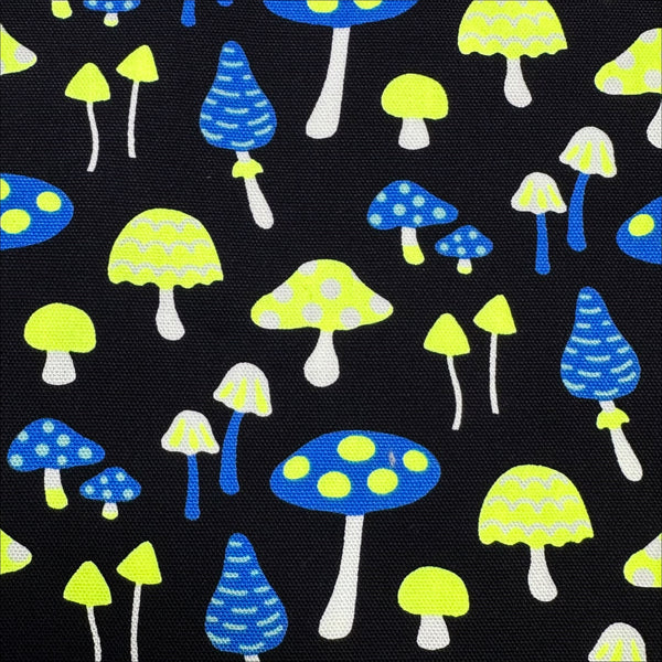Close up of Omushi Mushrooms Oxford cotton fabric in neon yellow and black, Japanese Import, medium weight cotton for sewing and quilting