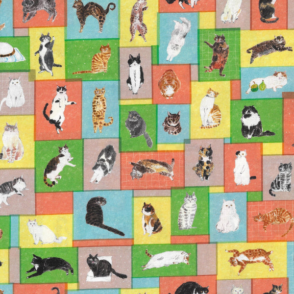 Paper Message Cats in Tiny Room Cotton Fabric by Okubo Junko for Kokka Japan, featuring cats arranged in blocks in blue, orange, and yellow.