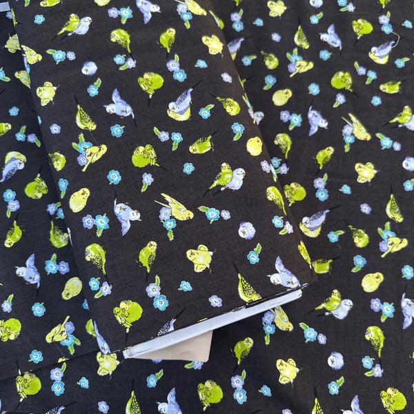 Bolt of Parakeet and Flower Cotton Fabric by Cosmo Textiles, style AP61903H 1F, featuring parakeets and flowers, in deep charcoal