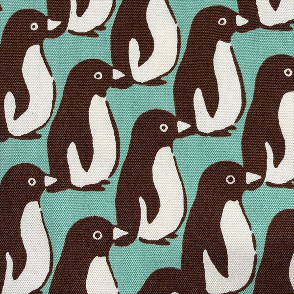 Close up of Penguin Country cotton oxford fabric by Sevenberry in aqua