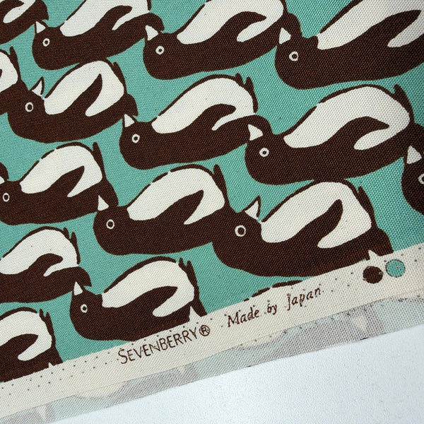 Selvage of Penguin Country cotton oxford fabric by Sevenberry in aqua