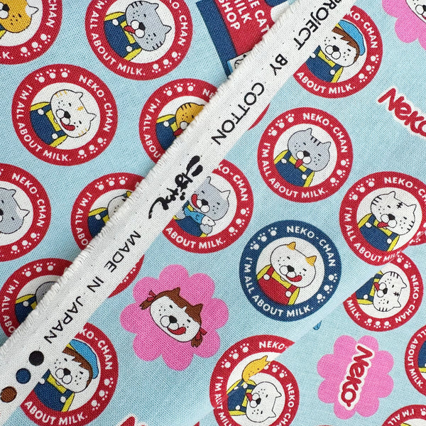 Selvage of Pero Neko Cats cotton canvas fabric in blue by Cotton Kobayashi featuring playful illustrated cats, imported from Japan
