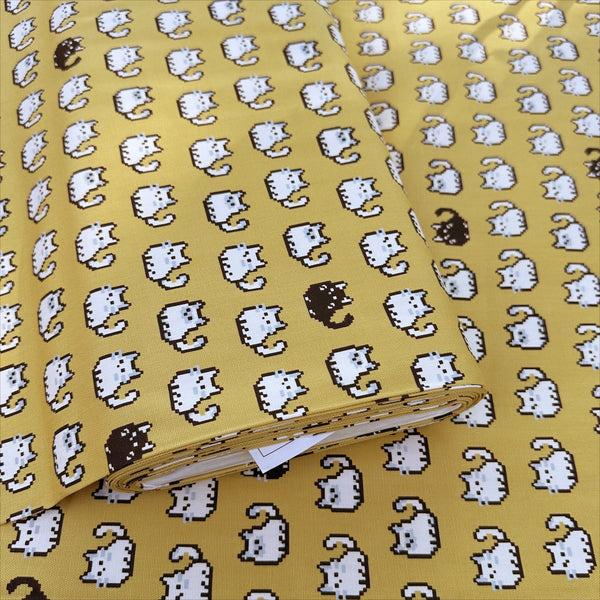 Bolt of Pixel Cats cotton oxford fabric in golden mustard with playful pixel-style cat print, imported from Japan
