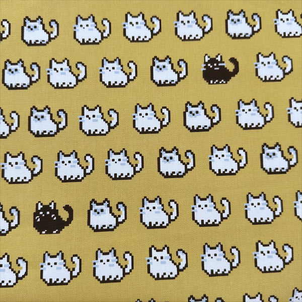 Pixel Cats cotton oxford fabric in golden mustard with playful pixel-style cat print, imported from Japan