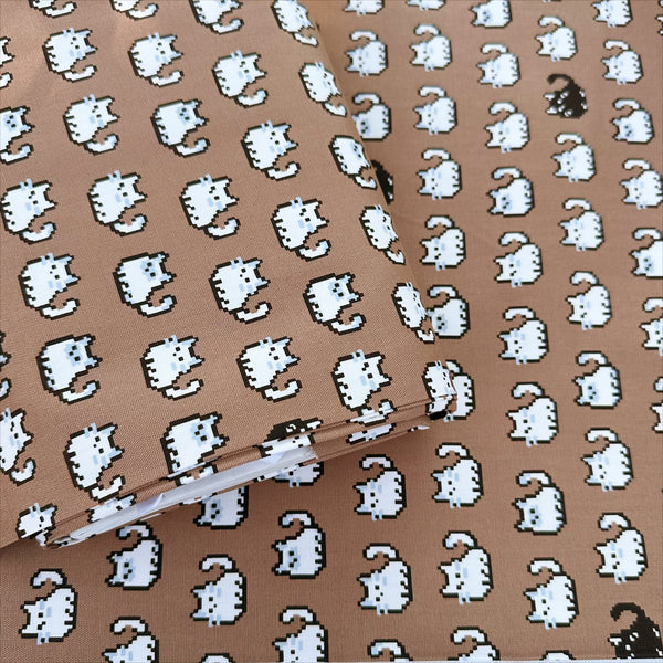 Bolt of Pixel Cats cotton oxford fabric in mocha with playful pixel-style cat print, imported from Japan