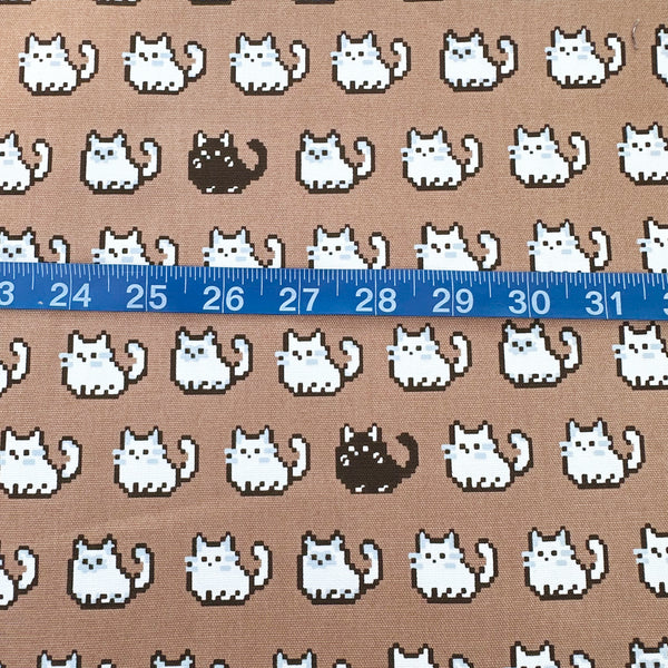 Scale of Pixel Cats cotton oxford fabric in mocha with playful pixel-style cat print, imported from Japan