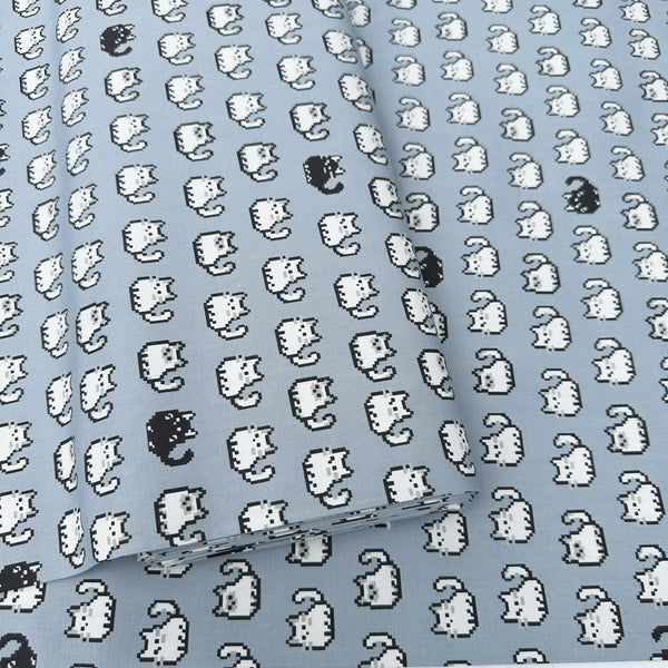 Bolt of Pixel Cats gray cotton oxford fabric featuring a repeating pattern of pixel-style cat motifs arranged in rows.