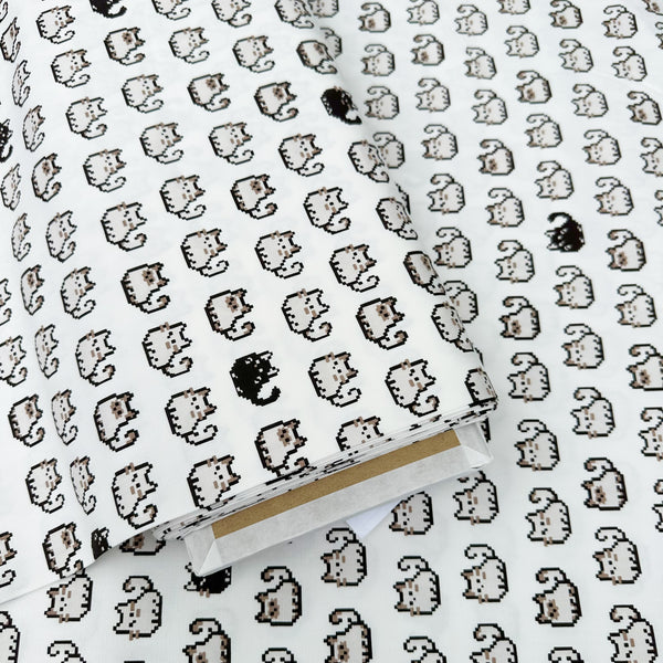 Bolt of Pixel Cats white cotton oxford fabric featuring a repeating pattern of pixel-style cat motifs arranged in rows.