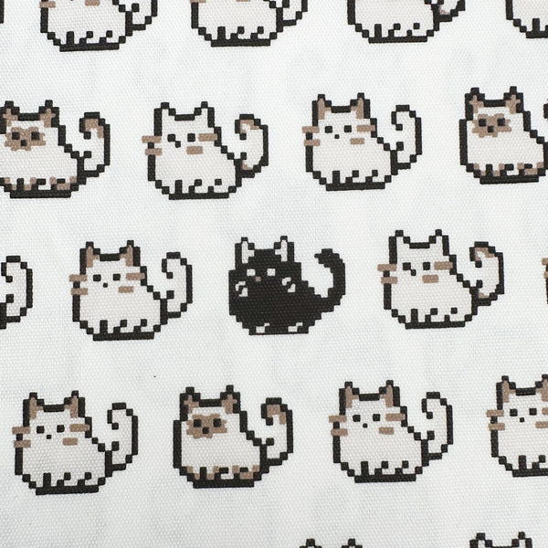 Close up of Pixel Cats white cotton oxford fabric featuring a repeating pattern of pixel-style cat motifs arranged in rows.