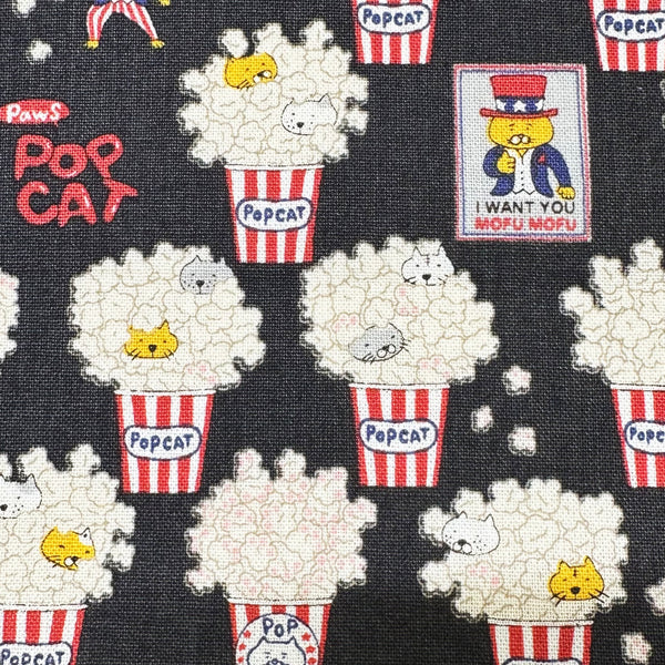 Pop Cat canvas fabric in black cotton linen blend by Cotton Kobayashi featuring cats hiding in popcorn