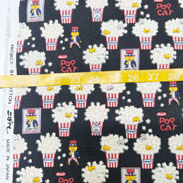 Scale of Pop Cat canvas fabric in black cotton linen blend by Cotton Kobayashi featuring cats hiding in popcorn