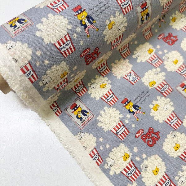 Bolt of Pop Cat canvas fabric in gray cotton linen blend by Cotton Kobayashi featuring cats hiding in popcorn