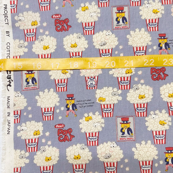 Scale of Pop Cat canvas fabric in gray cotton linen blend by Cotton Kobayashi featuring cats hiding in popcorn