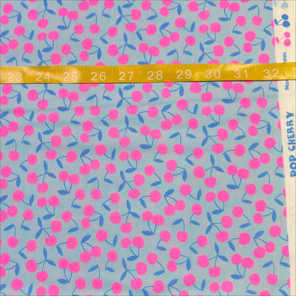 Scale of Pop Cherry cotton fabric with neon pink and light blue cherries, Japanese Import, quilt weight cotton for sewing and quilting