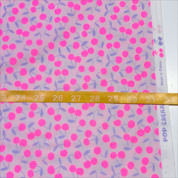 Scale of Pop Cherry cotton fabric with neon pink and purple cherries, Japanese Import, quilt weight cotton for sewing and quilting