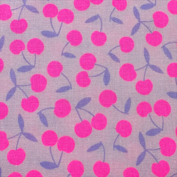 Close up of Pop Cherry cotton fabric with neon pink and purple cherries, Japanese Import, quilt weight cotton for sewing and quilting
