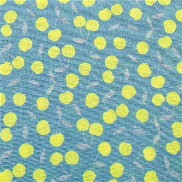 Close up of Pop Cherry cotton fabric with neon yellow and light blue cherries, Japanese Import, quilt weight cotton for sewing and quilting