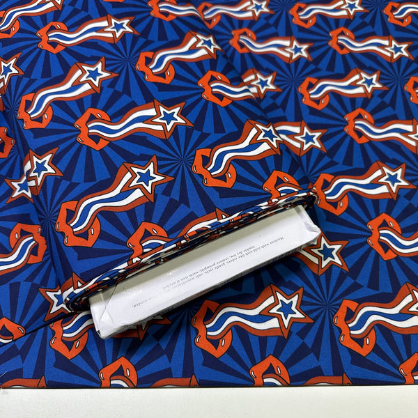 Bolt of Pop Stars Trippy Stars Cotton Fabric by Cloud 9 Fabrics, retro red white and blue star print.