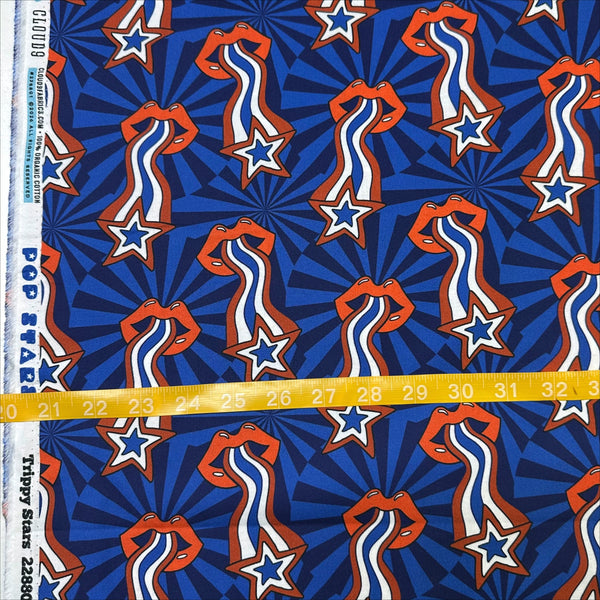 Scale of Pop Stars Trippy Stars Cotton Fabric by Cloud 9 Fabrics, retro red white and blue star print.
