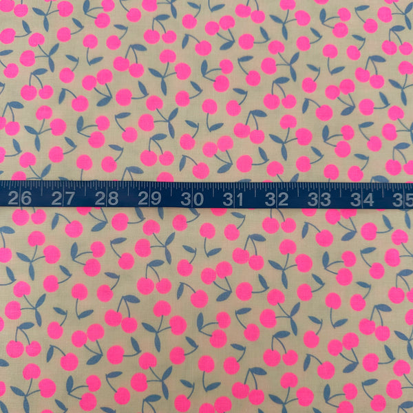 Scale of Pop Cherry Cotton Fabric in Cream and Neon Pink featuring a bold cherry print, imported from Japan.