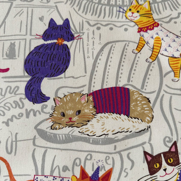 Close up of Powerful Animal Cats cotton oxford fabric by Kokka in ivory, style YGA-71000-1A