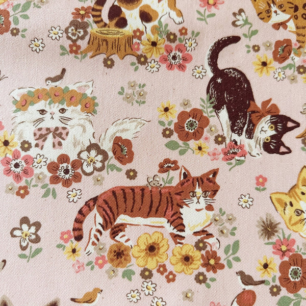 Close up ofnPowerful Animal Cats Garden cotton oxford fabric by Kokka in pink