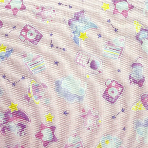 Close up of Puchi Parade Pop Treats cotton oxford fabric by Kokka in pink, YKA-46000-1C