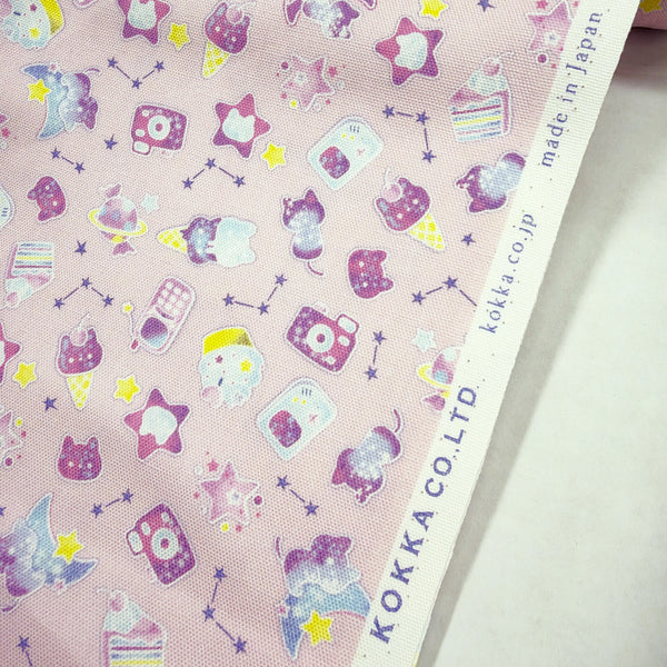 Selvage of Puchi Parade Pop Treats cotton oxford fabric by Kokka in pink, YKA-46000-1C
