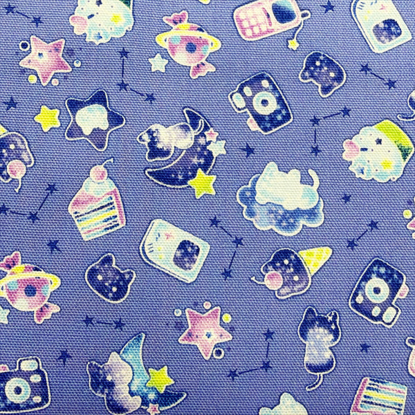 Close up of Puchi Parade Pop Treats cotton oxford fabric by Kokka in purple, YKA-46000-1B