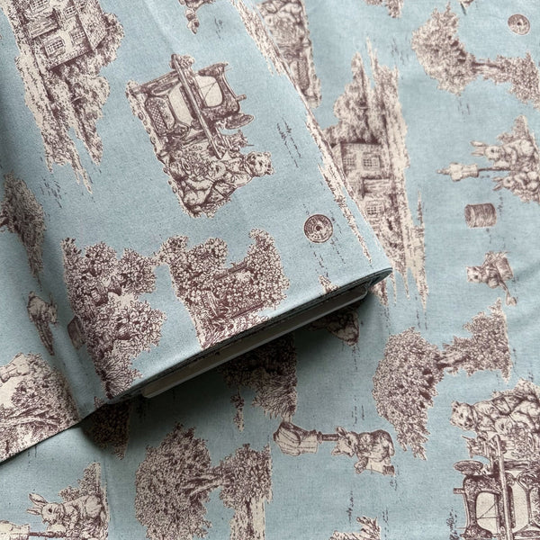 Bolt of Rabbit Toile de Jouy cotton fabric in blue
