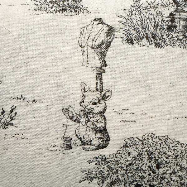 Close up of Rabbit Toile de Jouy cotton fabric in natural