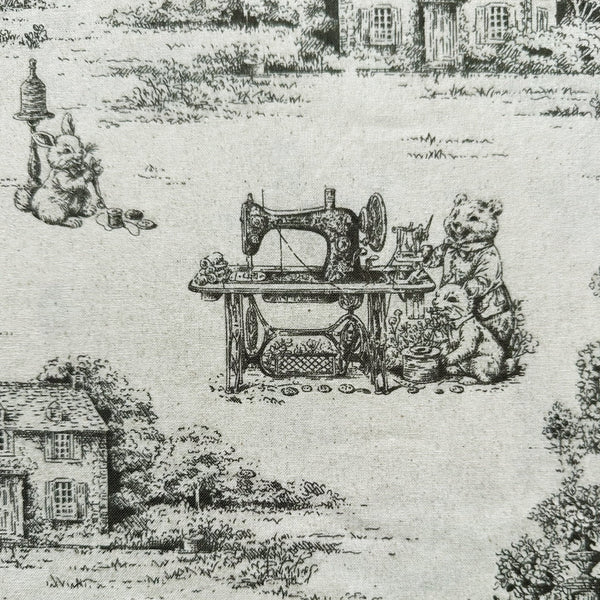 Close up of Rabbit Toile de Jouy cotton fabric in natural