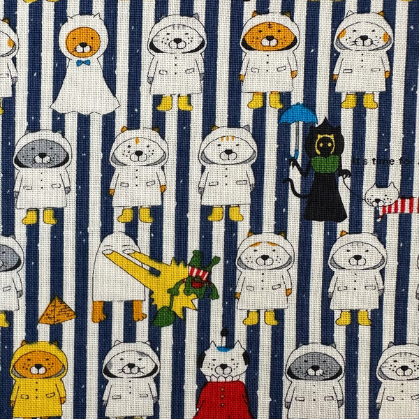 Close up of Raincoat Cats Cotton Canvas fabric by Cotton Kobayashi, style KTS-7194F, in navy stripe