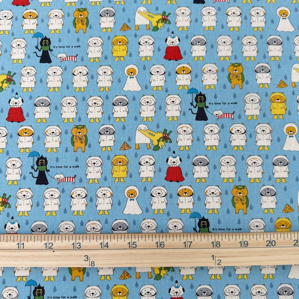 Scale of Raincoat Cats cotton canvas fabric by Cotton Kobayashi in sky blue