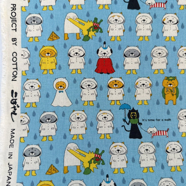 Selvage of Raincoat Cats cotton canvas fabric by Cotton Kobayashi in sky blue