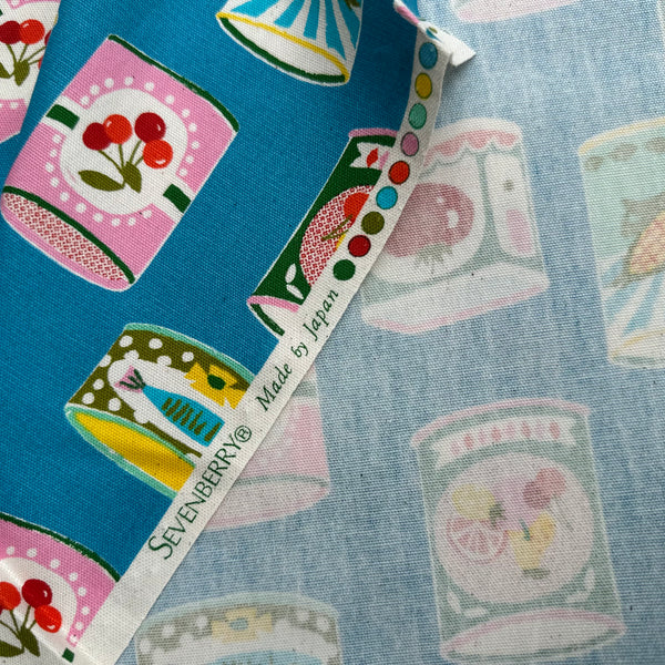 Selvage of Retro Cans cotton oxford fabric by Sevenberry in teal, style 850607