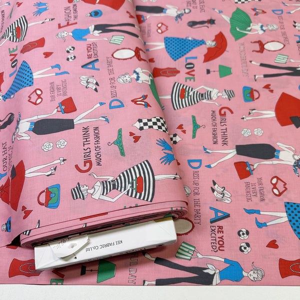 Bolt of Retro Fashionistas cotton fabric in pink featuring 1960s-era fashion ladies by Miyako Kawaguchi for Kei Fabrics