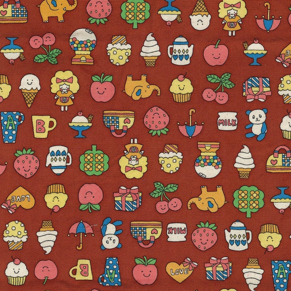 Close up of Retro School Cotton Oxford Fabric in Rust Red by Kokka – playful fruit, treats, animals, and children motifs on mid-weight cotton.