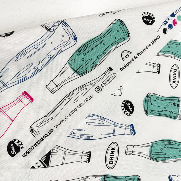 Selvage of Retro Soda Bottle cotton fabric by Cosmo Textiles in white, AP61109-2