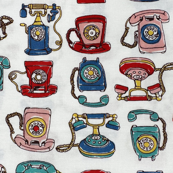 Close up of Retro Telephones cotton fabric by Cosmo Textiles in white, AP65904 2A