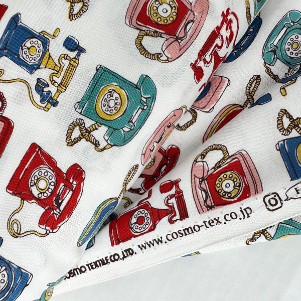 Selvage of Retro Telephones cotton fabric by Cosmo Textiles in white, AP65904 2A