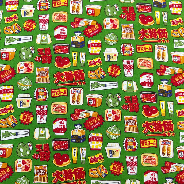 Retro Japanese Grocery cotton Oxford fabric by Cosmo Textiles featuring vintage-inspired Japanese food packaging and grocery motifs on a green background