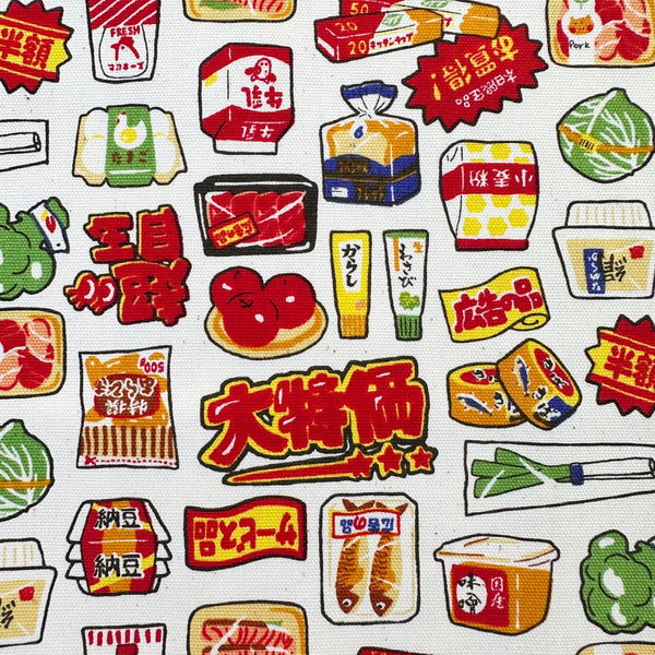 Close up of Retro Japanese Grocery cotton Oxford fabric by Cosmo Textiles featuring vintage-inspired Japanese food packaging and grocery motifs on a natural background