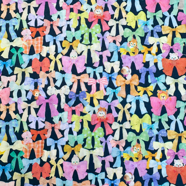 Ribbon Collector Cotton Lawn Fabric in Navy by Yukiemon for Hokkoh featuring whimsical ribbons and charming illustrated motifs on soft Japanese cotton lawn.