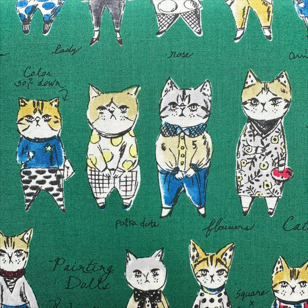 Close up of Rough Sketch Cat Cotton fabric by Yuwa Fabrics, style SK829981-G, in green
