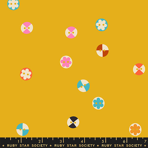 Buttons fabric by Ruby Star Society shown with scale reference