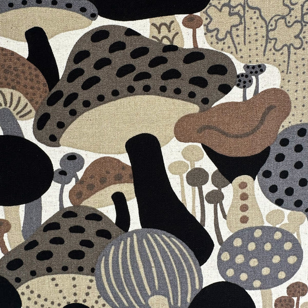 Close up of Scandi Mushrooms Cotton Linen Canvas Fabric by Cotton Kobayashi, style UP-9014 B, featuring Scandinavian mushrooms, in brown and gray, imported from Japan